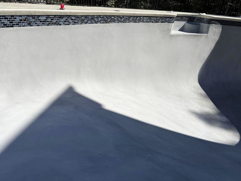 Gunite pool renovation with new glass tile