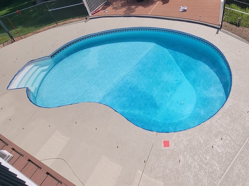 Pool deck restoration with polymer concrete system