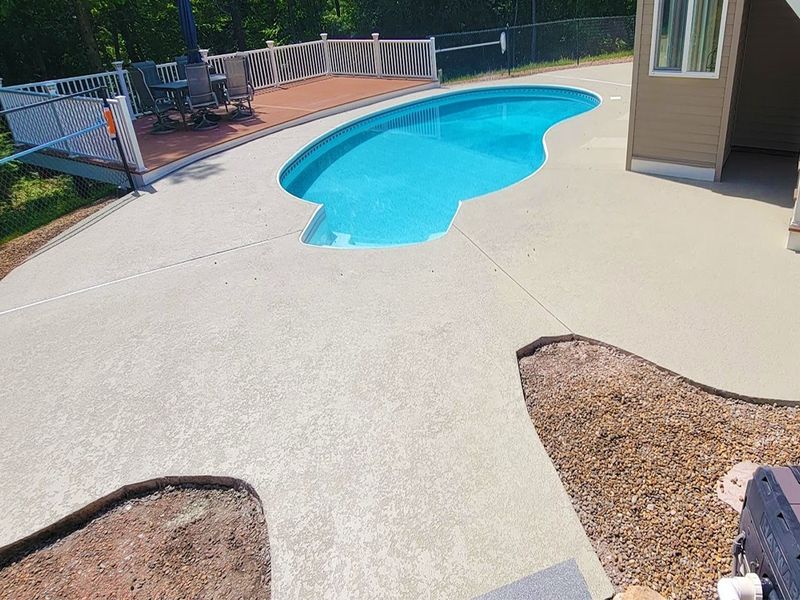 Stamped concrete pool deck overlay restoration