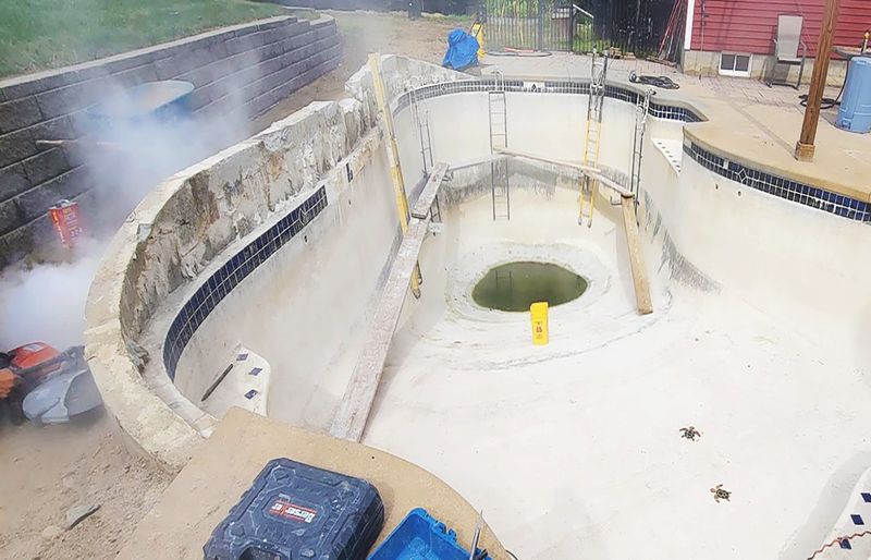 Plaster renovation swimming pool deep end