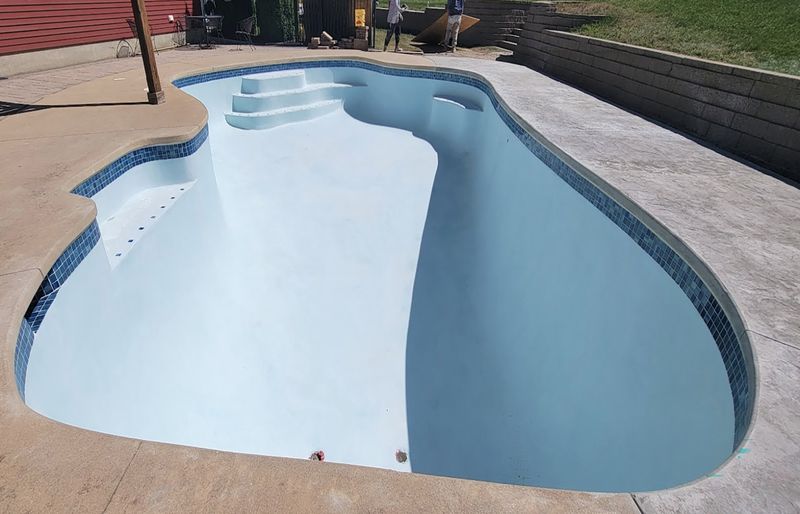 Pool replastering with new waterline tile