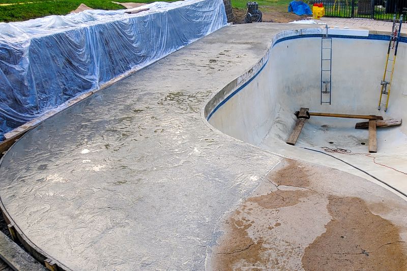 Pool deck extension with seamless polymer concrete overlay New England