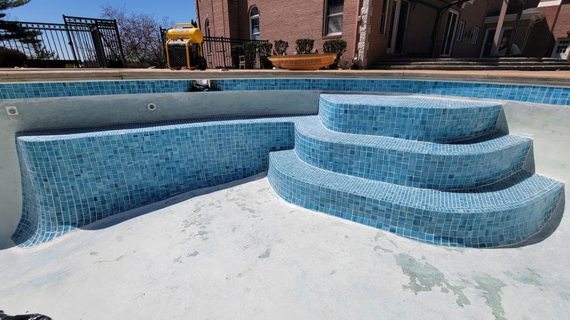 Glass mosaic tile pool waterline renovation