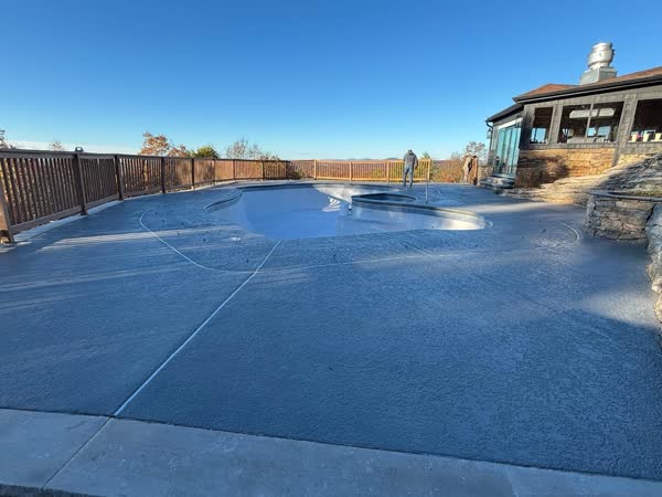Completed pool renovation with resurfaced deck and mountain panorama