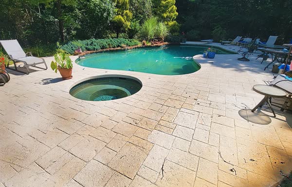 Before: Old worn paver pool deck